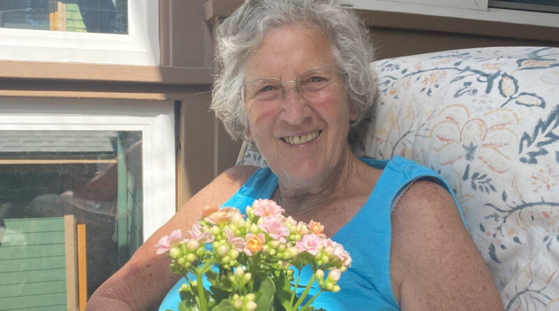 Ruth Beaglehole with flowers